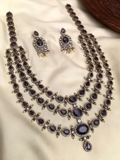 The same three-layered antique necklace, but with deep blue stones.
