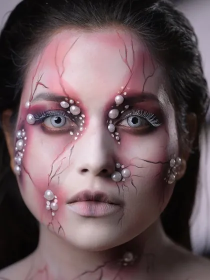 A direct, chilling stare from the finished character, showcasing the power of using contact lenses in SFX makeup.
