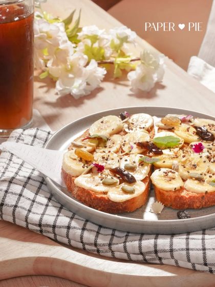 The month of love and brews, featuring our Almond Butter & Banana Toast alongside a refreshing cold brew. A perfect pairing.
