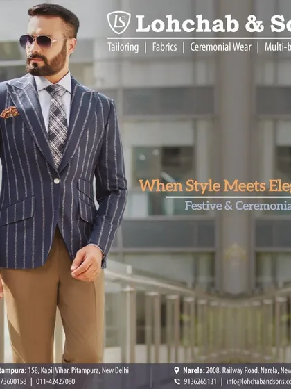 Elevate your festive or ceremonial look with our expertly tailored blazers. Here, a model wears a navy pinstripe blazer with classic brown trousers, demonstrating a timeless combination of style and elegance.