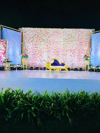 A wider shot of the floral wall stage, showing how the design fills the space and creates a truly immersive experience.