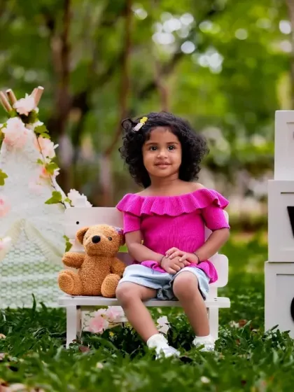 An outdoor second birthday shoot in one of Bangalore's lovely parks. The natural setting provides a beautiful backdrop for milestone portraits.