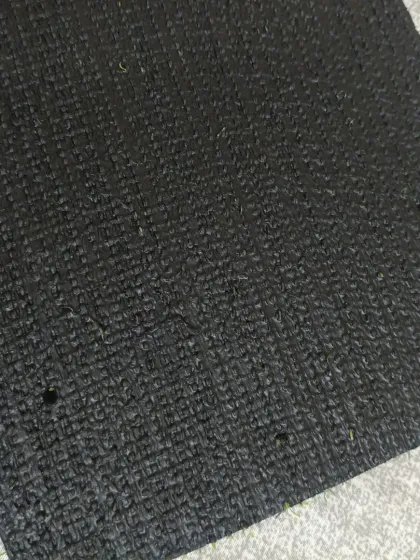 A view of the backing on the 15mm cricket turf. The strong, woven construction ensures the surface remains stable and flat, which is critical for sports use.