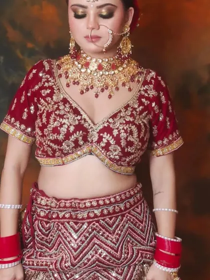 This maroon velvet bridal lehenga with a chevron-patterned skirt is perfect for a winter wedding. The heavy embroidery looks stunning in person.