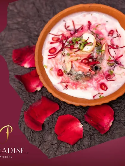 Blending love in every dish. A beautiful rose-flavored dessert served in a clay pot and garnished with fresh rose petals and pomegranate seeds.