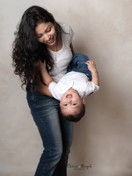 A candid and heartwarming moment between a mother and her child, filled with laughter and play. We love capturing these unposed, natural interactions that truly reflect the love within a family.