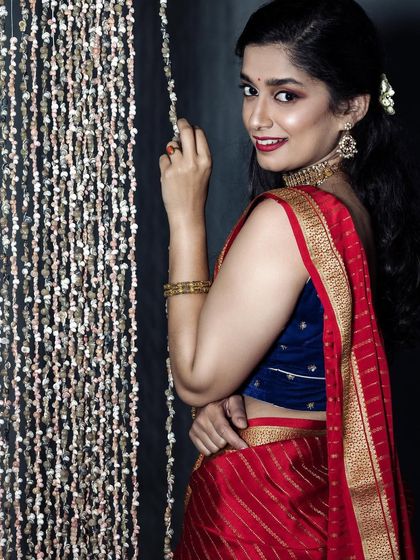 A classic photoshoot look with a bold red lip. This timeless style is perfect for portraits and gives an instant touch of glamour.