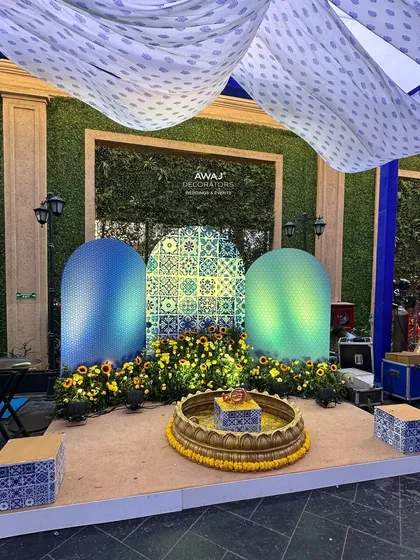 A wider view of the Haldi ritual stage, showing the beautiful draping and the thoughtful arrangement of all the ceremonial elements.