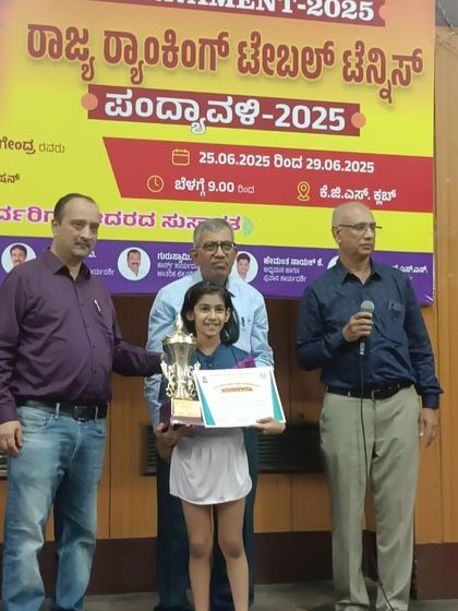 Saksha with her trophy and certificate at the 2nd State Ranking Tournament.