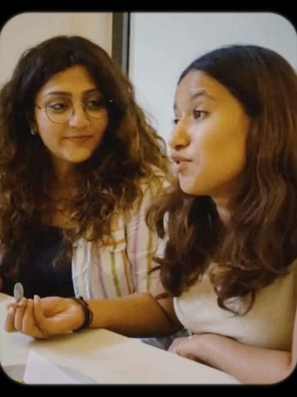 Two friends deep in conversation. It's the connections made here that truly build our community.