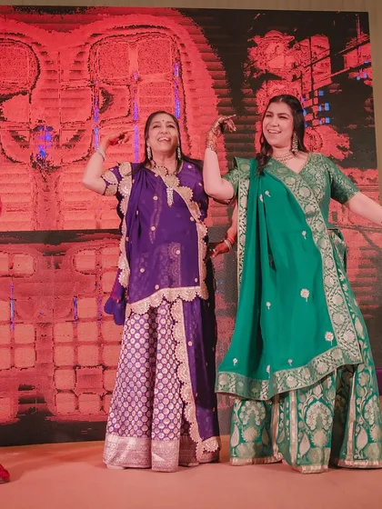 Family members from different generations dancing together. We create routines that bridge the age gap and bring everyone together.