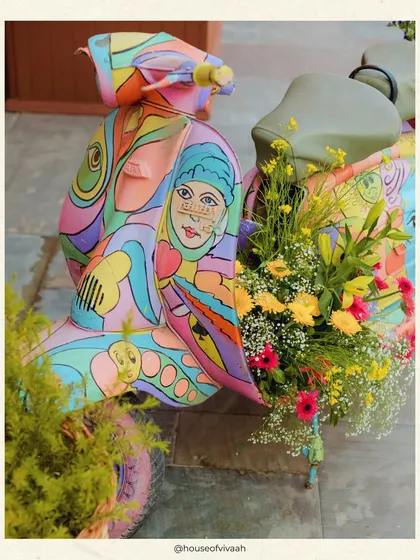 A close-up of the hand-painted Vespa, a key element of the Positano-themed Mehendi, showcasing its artistic and colorful design.