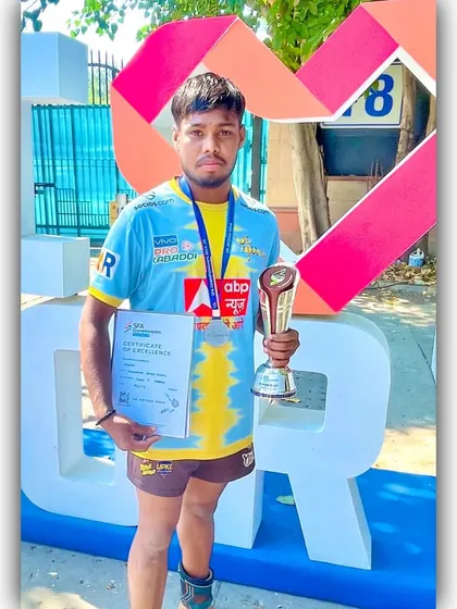 We develop young talent into champions. This is one of our Under-19 players proudly displaying his 2nd place medal, trophy, and certificate from the SFA Championship.