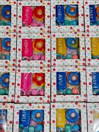 An army of colorful, personalized birthday hampers ready to go. I can create these custom soap boxes for any number of guests for your child's party.