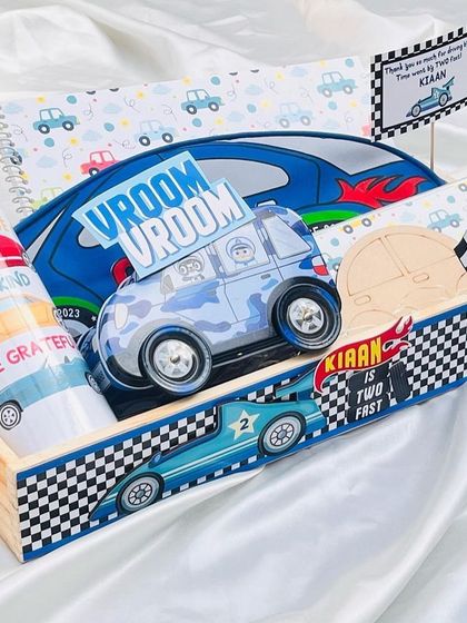 Vroom Vroom! A car themed birthday hamper for a little boy turning two. This set includes a personalised water bottle, a notebook, and a fun wooden car toy for painting.