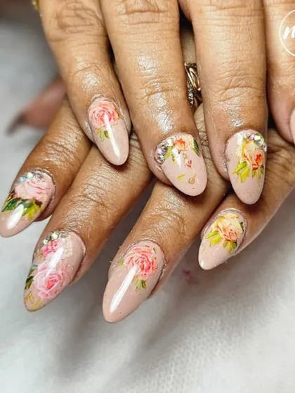 A perfect example of elegance. This hand-painted floral design on a neutral base is a client favorite. It’s subtle, sophisticated, and showcases the delicate brushwork that goes into creating timeless nail art.