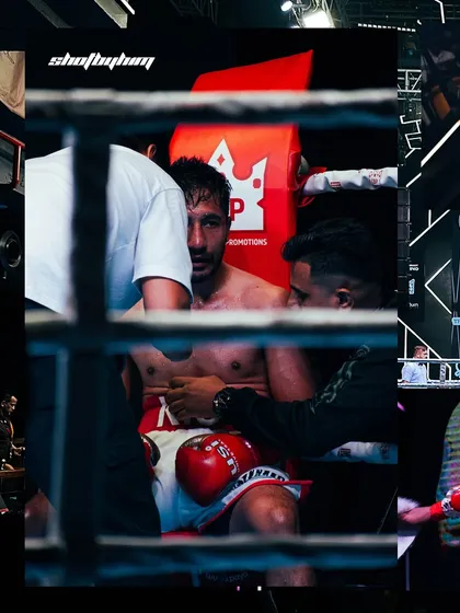 Some of the most critical moments happen between rounds. Shooting through the ropes, I capture the raw, unfiltered strategy sessions and the fighter's focus in the corner. This is the story behind the action.