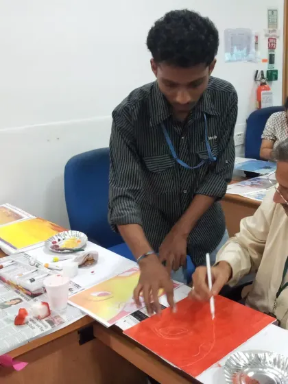 In my workshops, teamwork happens naturally. Here, one colleague helps another with their painting, sharing tips and encouragement. This is the spirit of collaborative art, where the process of creating together is as important as the final artwork.