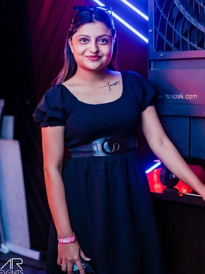 A guest posing at the bar.