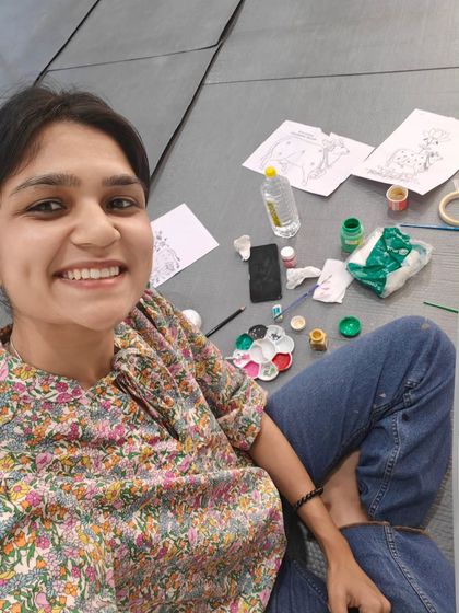 A behind-the-scenes selfie during the Pichwai office project, surrounded by my sketches and paints. This is where the magic happens!