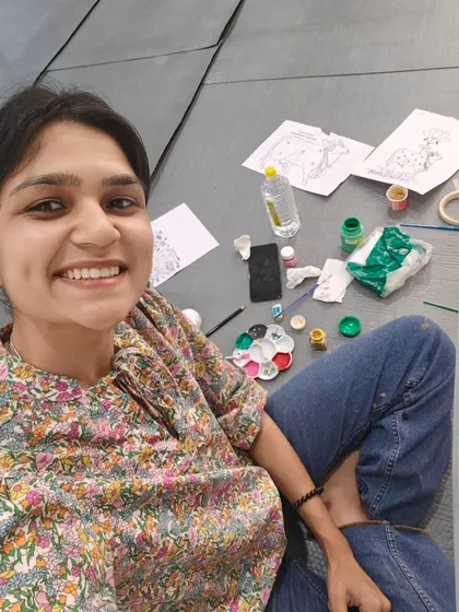 A behind-the-scenes selfie during the Pichwai office project, surrounded by my sketches and paints. This is where the magic happens!