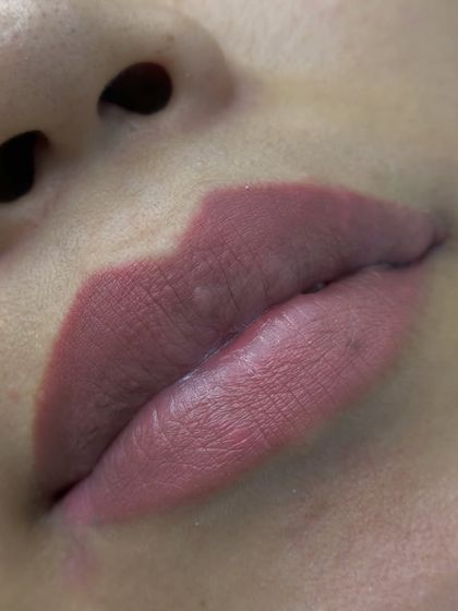 A detailed close-up of a healed lip blush. The color is perfectly blended and the lip line is defined, giving a fuller appearance without any filler.