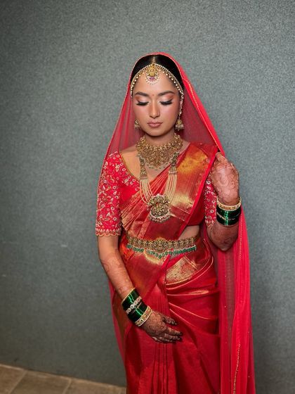 A serene, eyes-closed shot highlighting the shimmery eyeshadow and the flawless finish of the makeup.