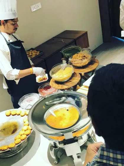 Our chef preparing plates at a live chaat counter for an event with Fast&Up founder, Shilpa Khanna. We ensure every plate is served hygienically and customized to each guest's preference.