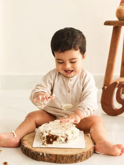 Digging in! The fun has officially started. I love the concentration and joy on his face as he explores his first birthday cake. These messy moments make for the best memories.