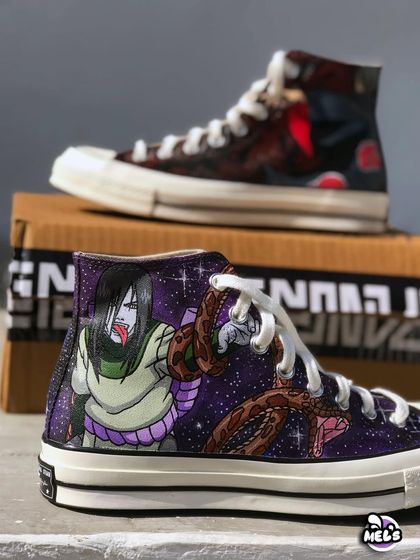 Another view of the stacked Naruto Converse, showcasing the full artwork on both the Orochimaru and Itachi shoes.