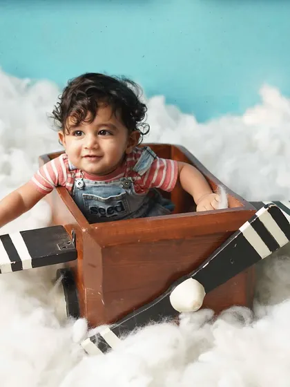 A candid moment of play during the aviator shoot. I let kids be kids, which results in the most natural and joyful photos.