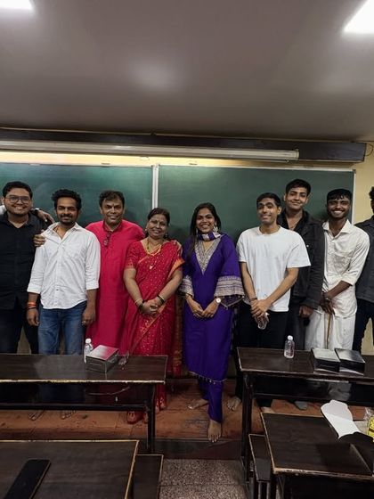 The team of male teachers and students posing together during the pooja celebrations, showcasing the camaraderie in our classes.