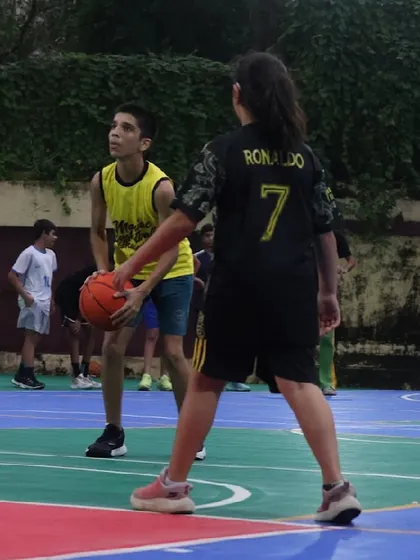 A one-on-one drill in progress. These moments are crucial for teaching both offensive and defensive skills in a game-like context.
