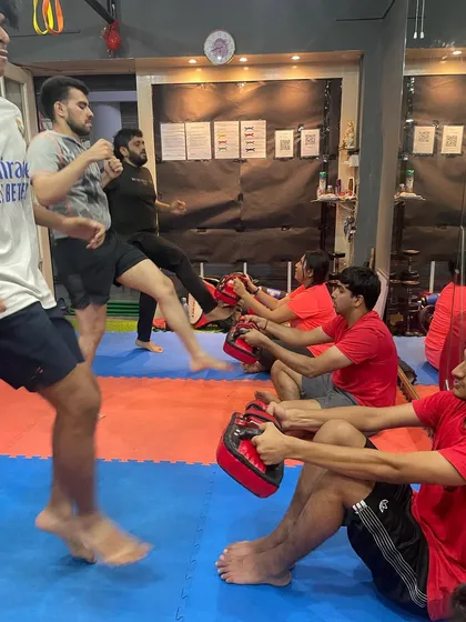 A Wednesday leg day session with the group. While some members practice kicks, others work on core strength, creating a dynamic and challenging environment for everyone.