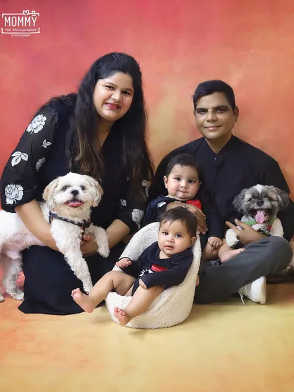 The whole family is here, including the furry members! I absolutely love when pets join the session. This studio portrait captures the complete, happy, and chaotic love of a full house.