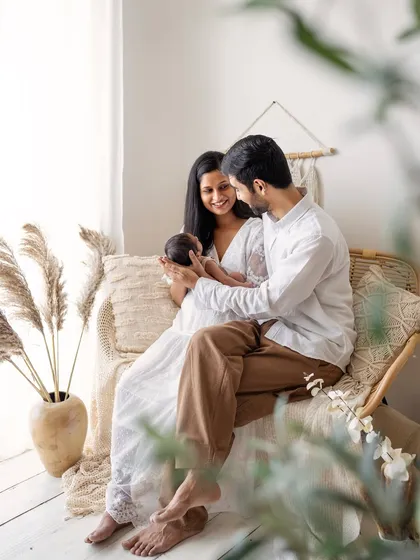 Dad joins in for a sweet family photo. The way they are both looking at their new baby is just everything.