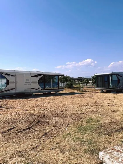 Our Space Capsule E8 units being positioned on-site in Bulgaria. This image captures the ease of transport and installation that makes our modular solutions so efficient for commercial projects.