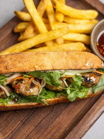 The Bánh Mì served with a side of crispy fries, a perfect pairing for a satisfying brunch.
