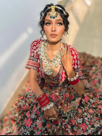 The sunlight beautifully highlights the details of this unique floral bridal lehenga.