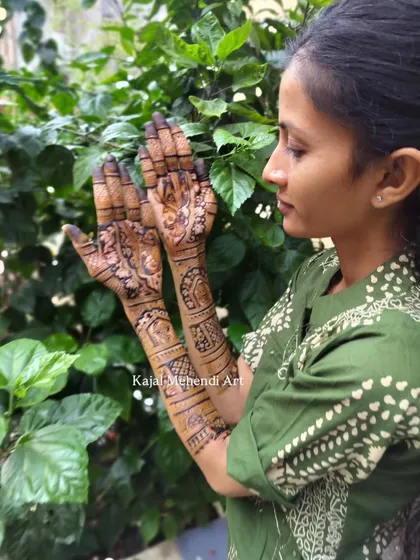 A beautiful bride showing off her intricate henna design. I love capturing these moments where the bride is admiring the art that will be a part of her wedding memories.