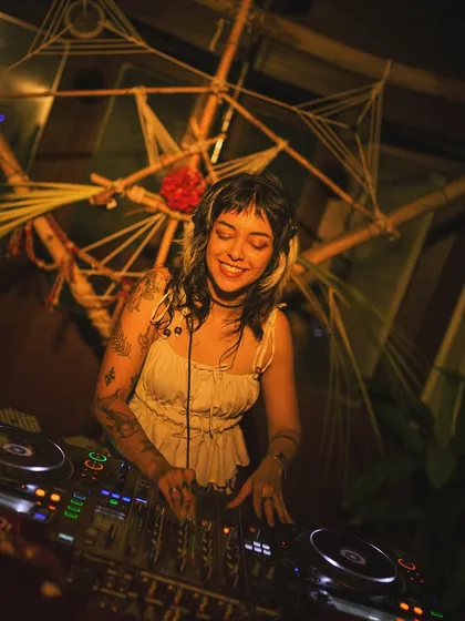 Finding my groove at a gig with some beautiful, earthy decor. The venue's vibe always adds a special layer to the music.