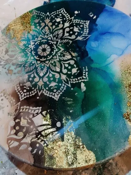 This beautiful alcohol ink resin art piece with a mandala design is one of the techniques I teach. Join my workshop to explore the captivating world of alcohol inks and resin.