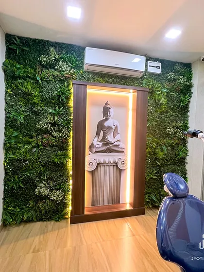 Who says a clinic has to feel clinical? For this dental practice, I created a calming oasis with a vertical garden and a serene Buddha statue, making the space feel tranquil and positive for patients.