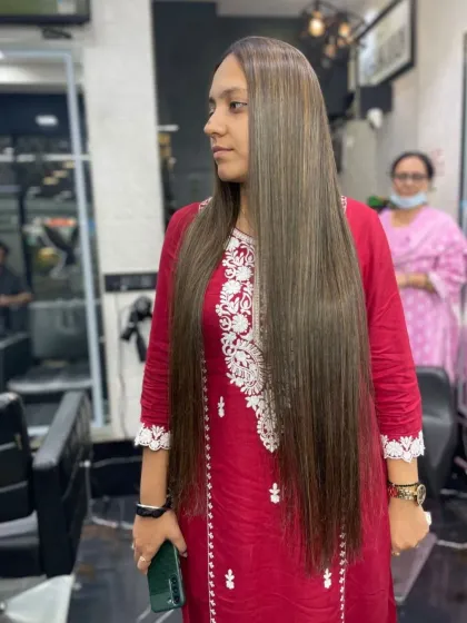 This client's very long hair received a smoothing treatment to make it sleek and manageable. The result is a beautiful, healthy shine that extends all the way to the ends.