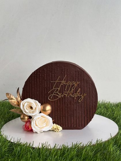 The cake top forward design before we added the custom yoga topper. Its simple, elegant flower decor makes it beautiful on its own.