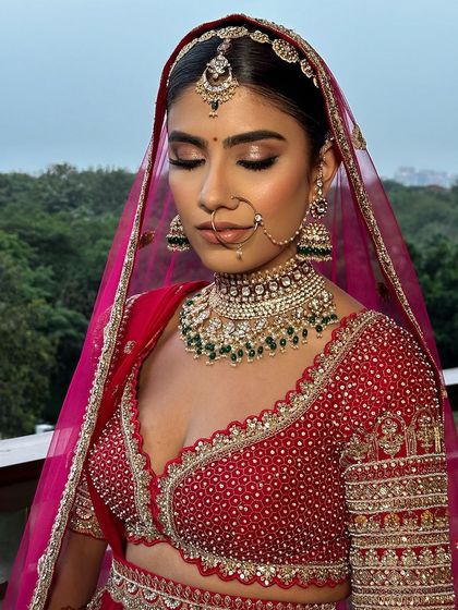 A close-up of a bride's serene expression, her hair perfectly complementing her look.