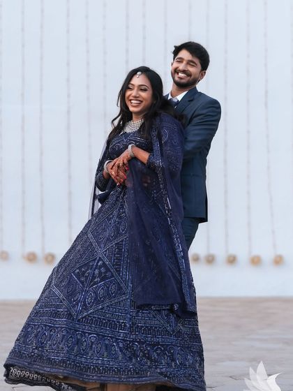 A happy, candid photo of the couple. Their genuine smiles and laughter make this a heartwarming and memorable shot from their reception.