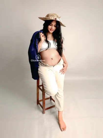A modern and chic maternity portrait. This mom-to-be's casual and confident pose in stylish, everyday clothes shows that maternity photos can be fashionable and reflect your personal style.
