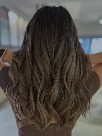 A balayage refresh is perfect for maintaining that sun-kissed look. Here, I added a mix of highlights and lowlights to touch up the existing color, boosting brightness and dimension for a fresh, blended finish.