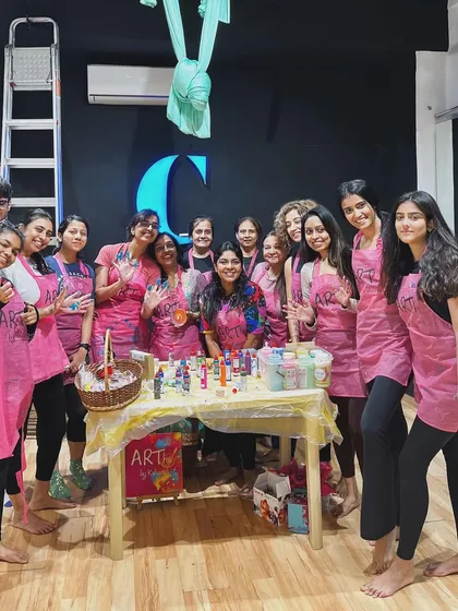 A group photo from my fluid art and aerial yoga collaboration workshop. It was a full house, with people from all walks of life coming together to try something new.